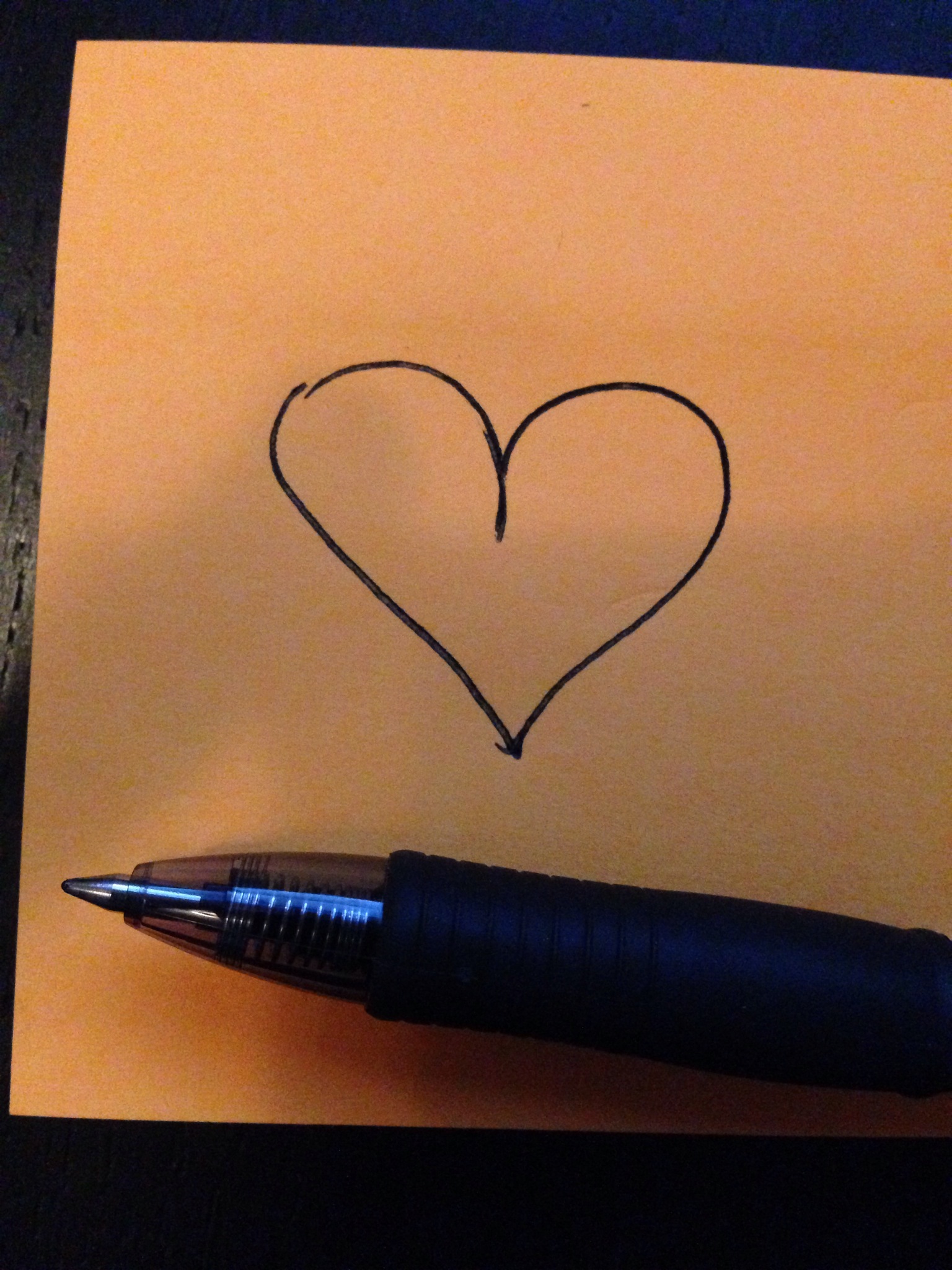 heart on post it note with pen