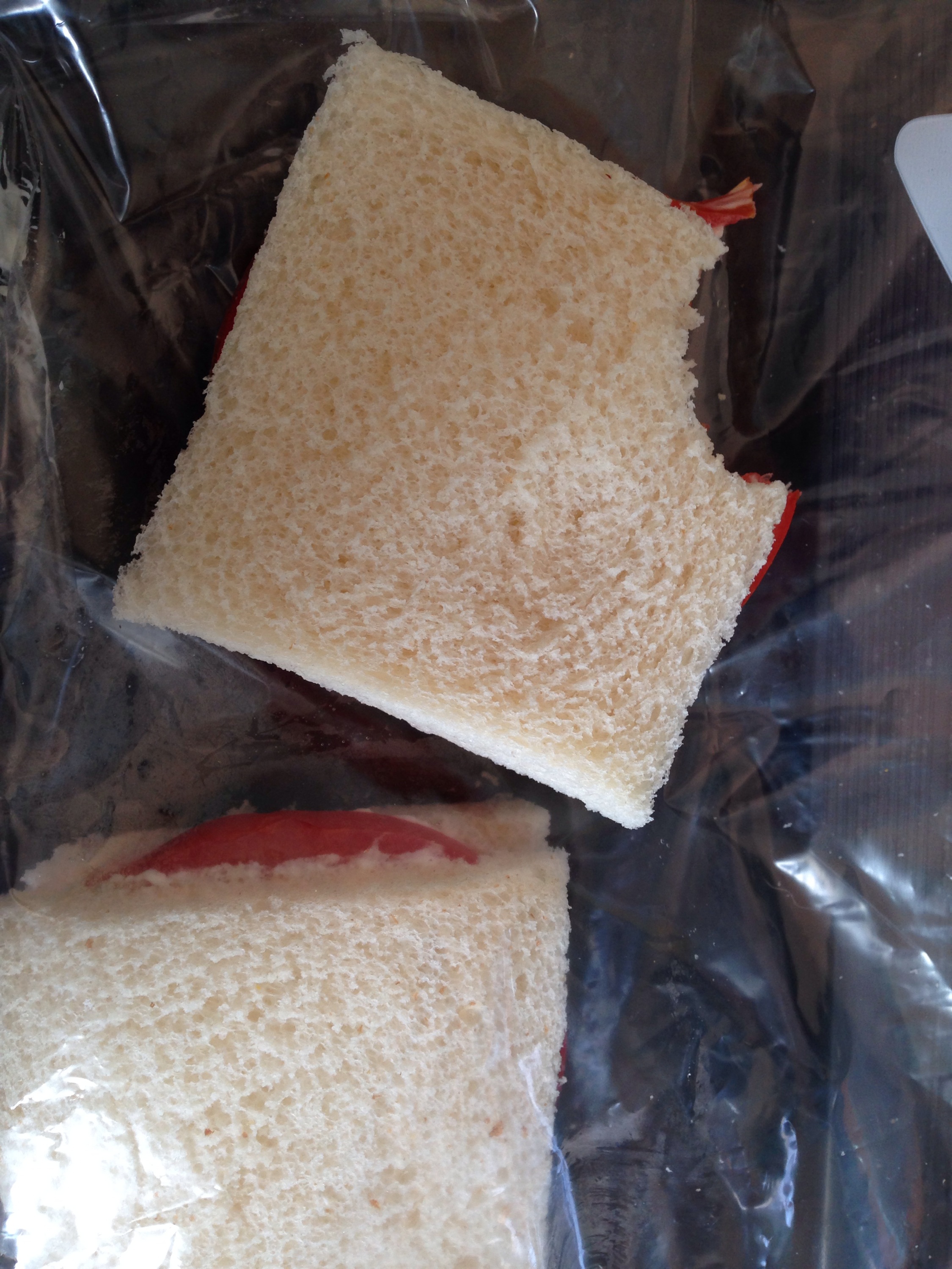 tomato sandwiches on white bread with the crust cut off