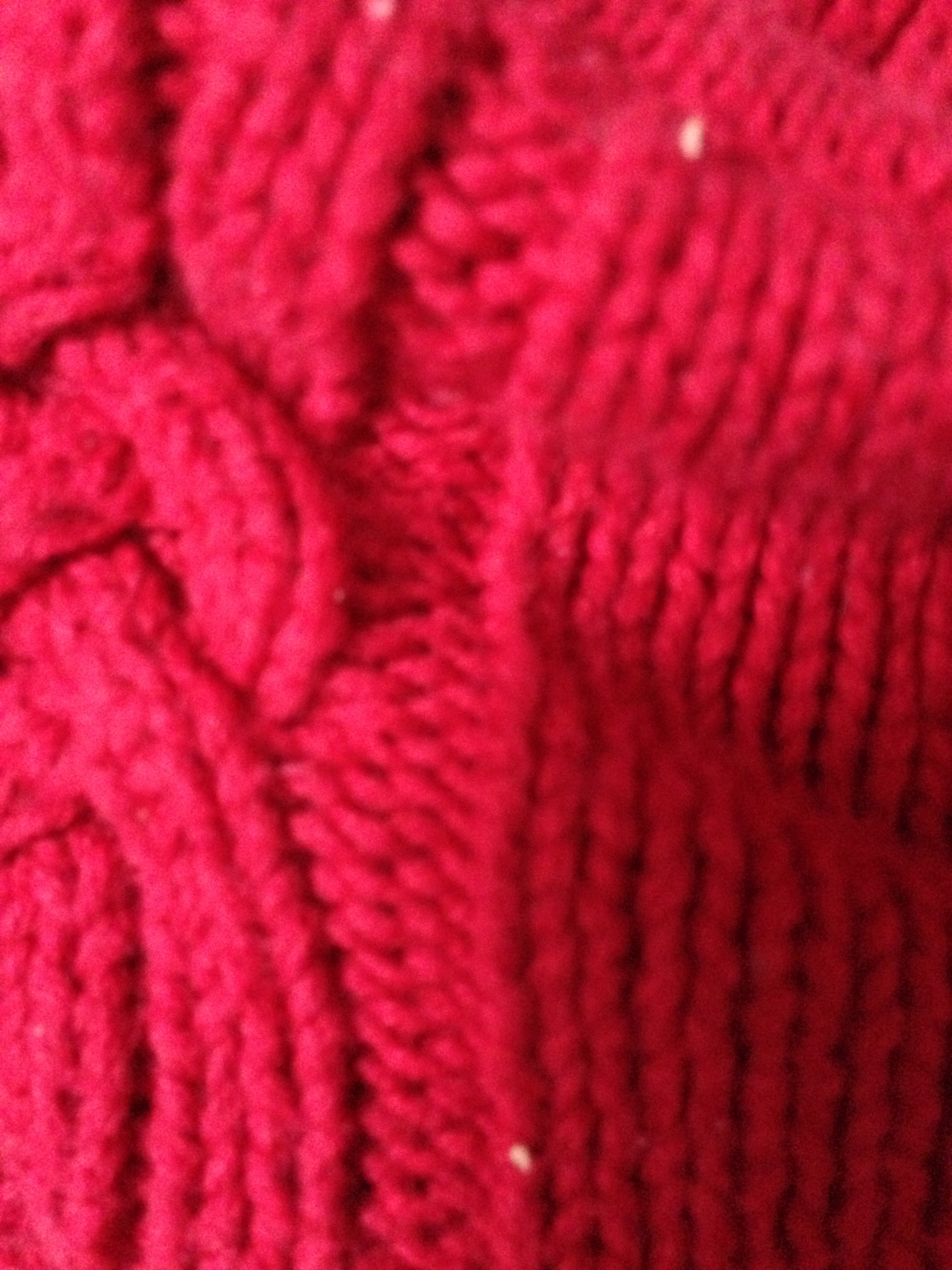 red cable knit sweater texture