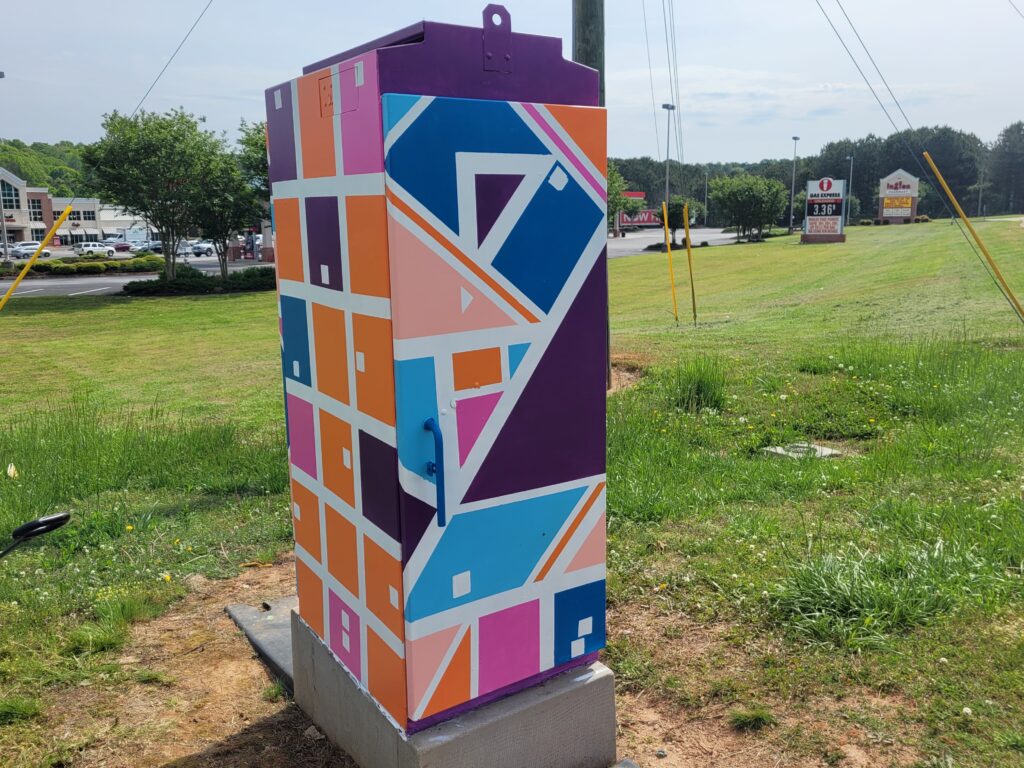 "Party for Squares Only" public art - traffic signal box art for City of Stockbridge by Steph Calvert Art - https://stephcalvertart.com