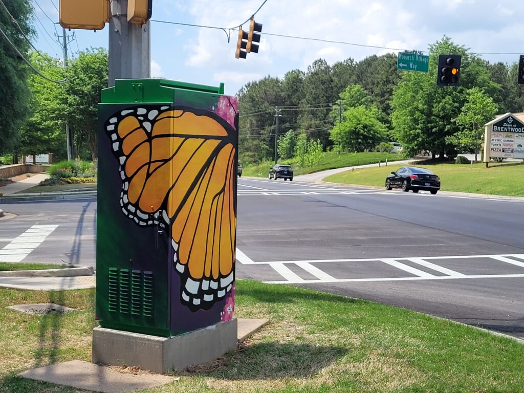"Monarch Village" Public Art - Traffic Signal Box Mural in Stockbridge Georgia  by Steph Calvert Art / https://stephcalvertart.com/